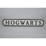 A painted wood Harry Potter 'Hogwarts' road sign, 14 x 78cm long