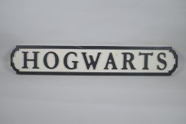 A painted wood Harry Potter 'Hogwarts' road sign, 14 x 78cm long