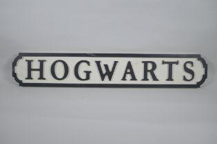 A painted wood Harry Potter 'Hogwarts' road sign, 14 x 78cm long