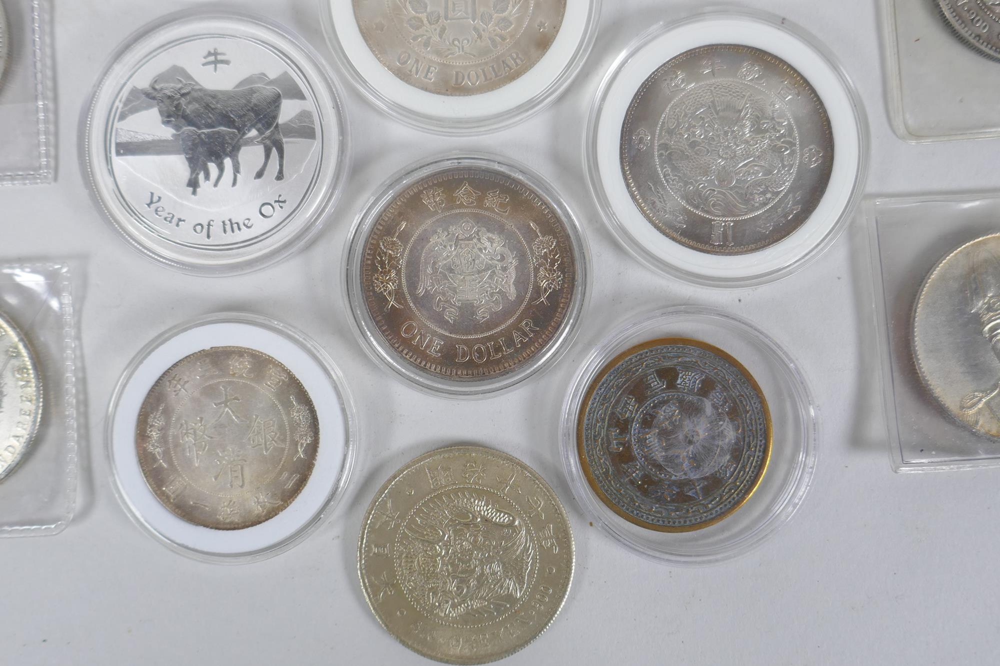 A quantity of Chinese facsimile (replica) white metal coinage, many coins in collector's cases - Image 3 of 5