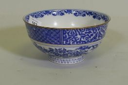 An oriental bowl with blue and white transfer decoration, 15cm diameter