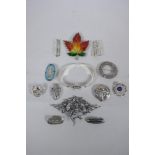 A quantity of vintage silver jewellery to include brooches, bangles and pendants