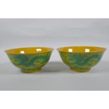 A pair of yellow ground porcelain bowls with incised and green glazed dragon decoration, Chinese3