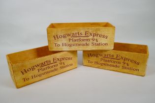 A set of three Harry Potter 'Hogwarts Express' wooden condiment trays, 28 x 12cm