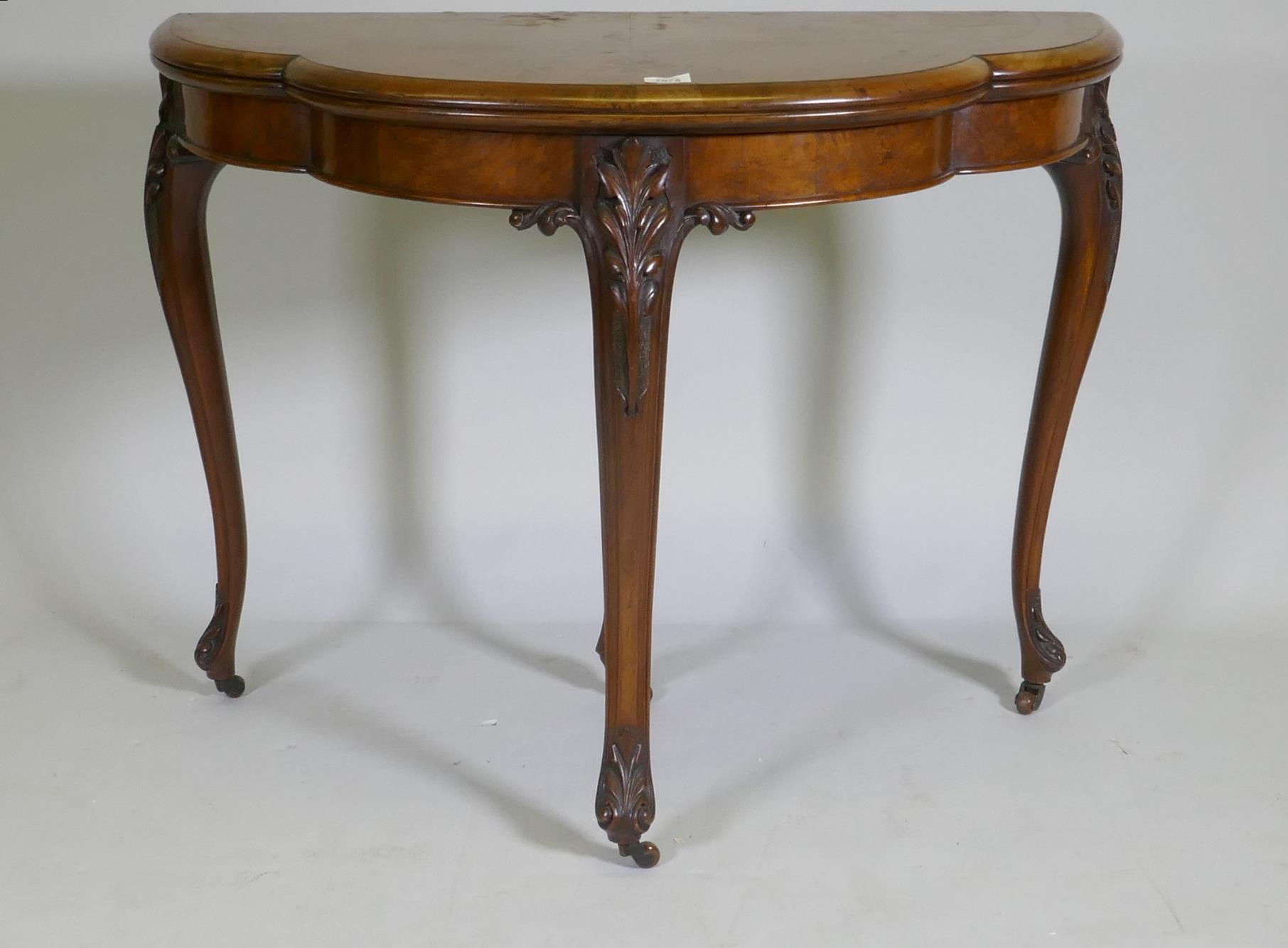 Victorian inlaid burr walnut shaped top card table, fitted with drawer to back, raised on carved