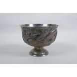 An antique Chinese silver plated stem bowl with raised dragon decoration, indistinct mark to base,