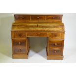 A C19th continental mahogany pedestal desk, the upper section with three drawers over a pull down