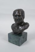 A Greco-Roman style bronze bust, 14cm high