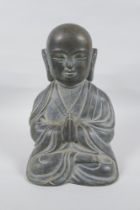 A Sino Tibetan bronze figure of Buddha, 28cm high