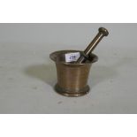 An C18th bronze mortar and pestle, 9cm high