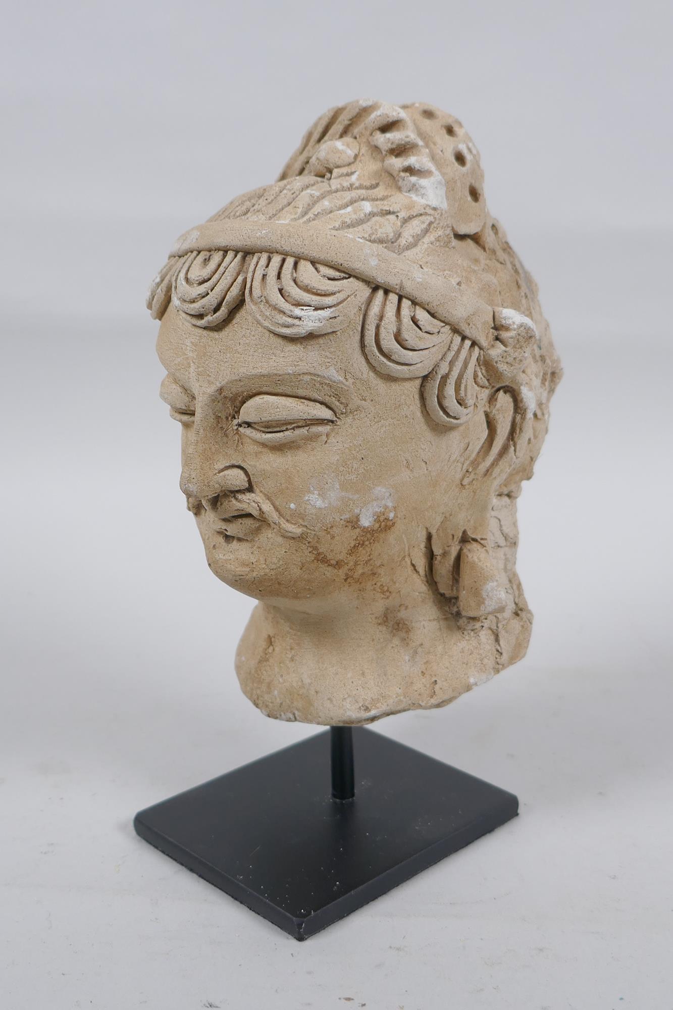 A Gandahar style plaster bust, on a display stand, 18cm high - Image 2 of 3