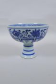 A Chinese blue and white porcelain stem bowl with dragon and lotus flower decoration, 12cm high x