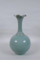 A Chinese Ru ware style porcelain vase with a frilled rim and ribbed neck, 28cm high