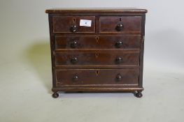 A C19th miniature mahogany chest of two over three drawers, raised on bun feet, 35 x 17 x 33cm