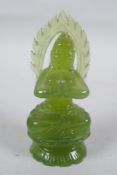An oriental carved green jade Buddha, 10cm high