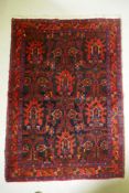 A Persian Hamadan red ground wool rug with unique geometric design, 148 x 104cm