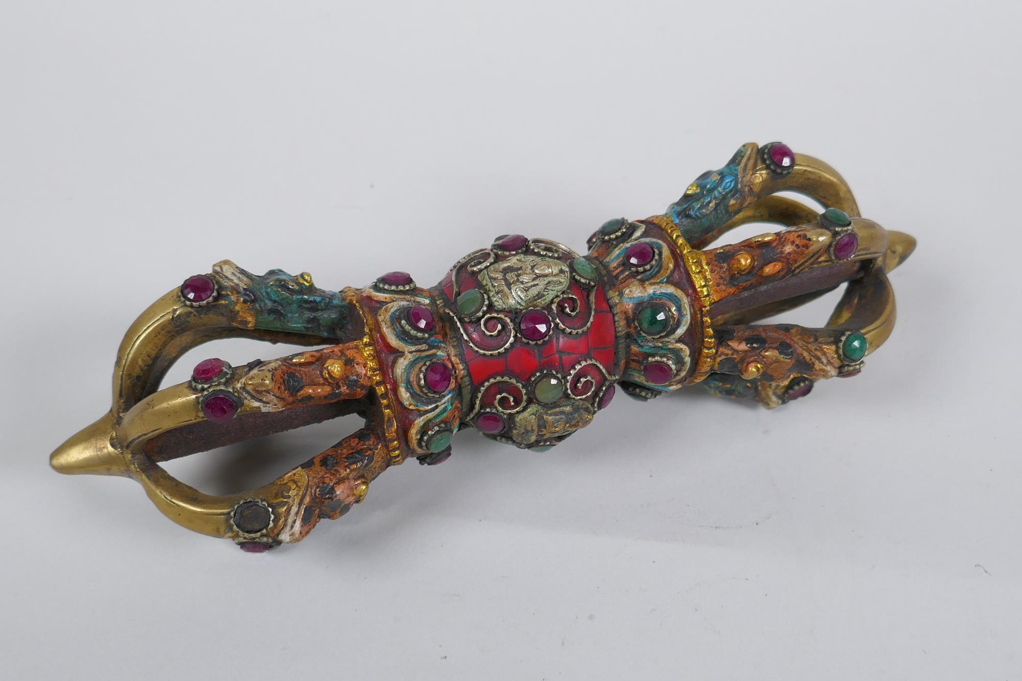A Tibetan ceremonial bronze vajra with painted details and stone settings, 23cm long - Image 2 of 3