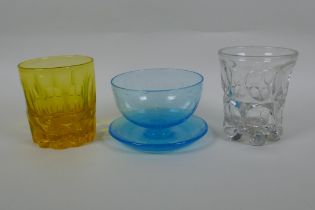 A Victorian uranium pressed glass tumbler and another, and a Walsh blue Pompeian glass grapefruit