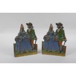 A pair of antique cold painted bronze and brass book ends themed after the opera The Duenna, 16cm