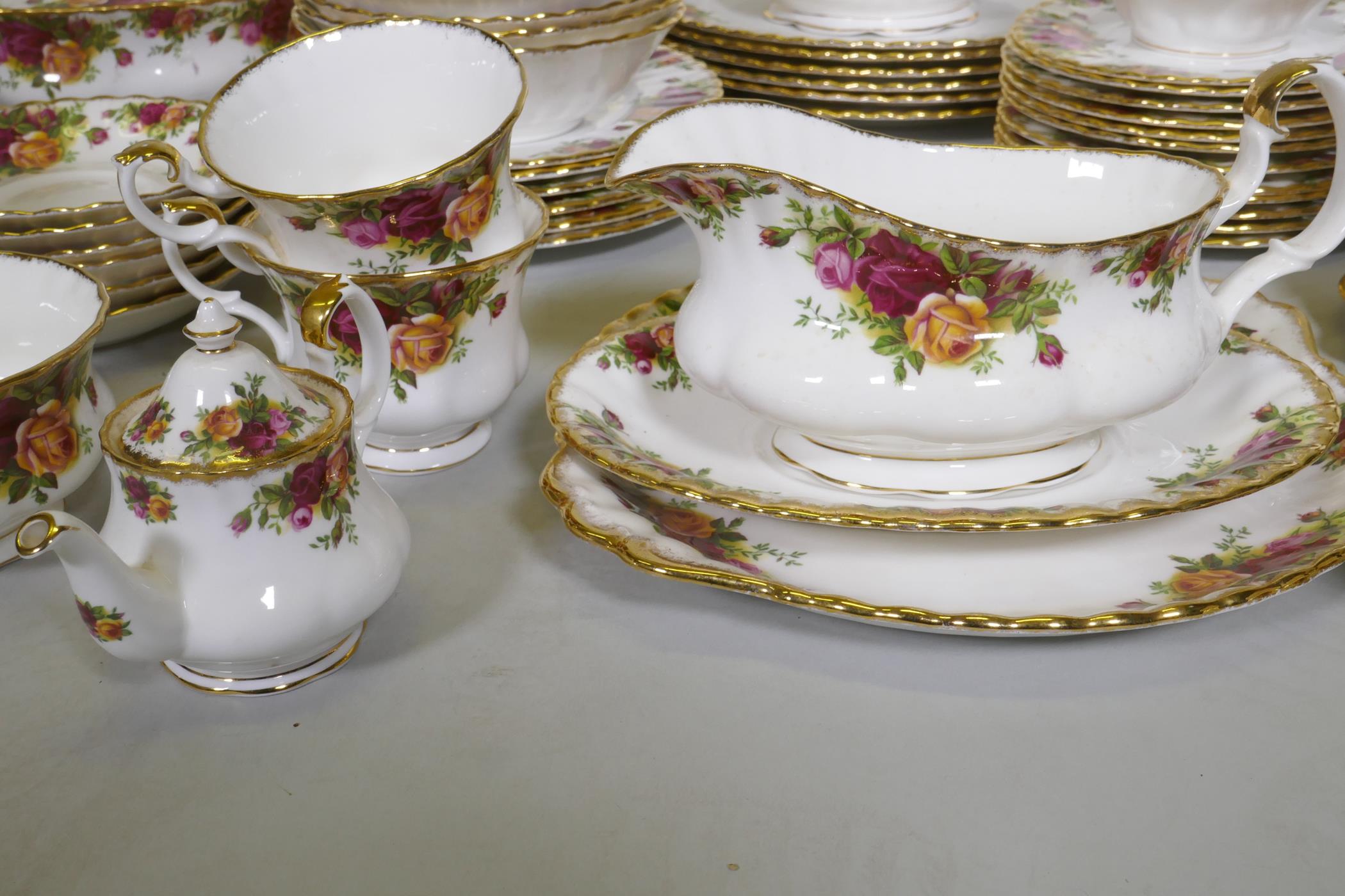 A Royal Albert Country Rose six place dinner service, with serving plates, tureens etc, appears - Image 5 of 7