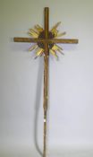 A continental giltwood and polychrome processional crucifix, with carved and moulded detail