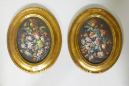 A pair of still life, flowers, in the C18th style, unsigned, in oval gilt frames, C20th, oils on