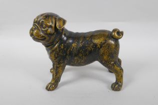 A filled gilt bronze pug dog, 21cm long