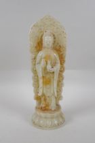 A Chinese reconstituted hardstone figure of Guan Yin, 28cm high