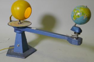 A vintage German tinplate and metal tellurium, with illuminating sun, lacks crank and moon, 67cm x