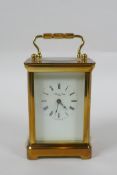 A brass cased Henley carriage clock, retailed by Charles Greig, the dial with Roman numerals, 8 x