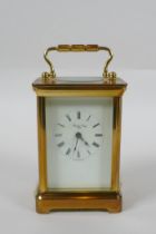 A brass cased Henley carriage clock, retailed by Charles Greig, the dial with Roman numerals, 8 x