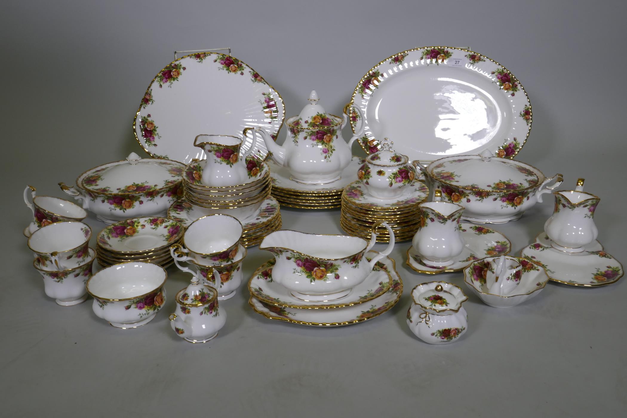 A Royal Albert Country Rose six place dinner service, with serving plates, tureens etc, appears