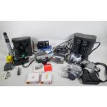 A collection of cameras and equipment, to include an Olympus PEN-EE, an Olympus Trip 35, an