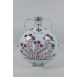 A red and white porcelain two handled moon flask with floral decoration, Chinese Xuande 6