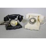 A vintage black GPO telephone with pull out slide, type 223F, and another in white, type 332L