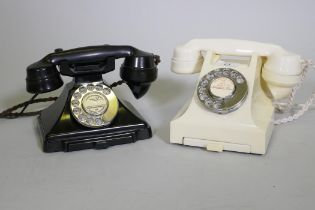 A vintage black GPO telephone with pull out slide, type 223F, and another in white, type 332L
