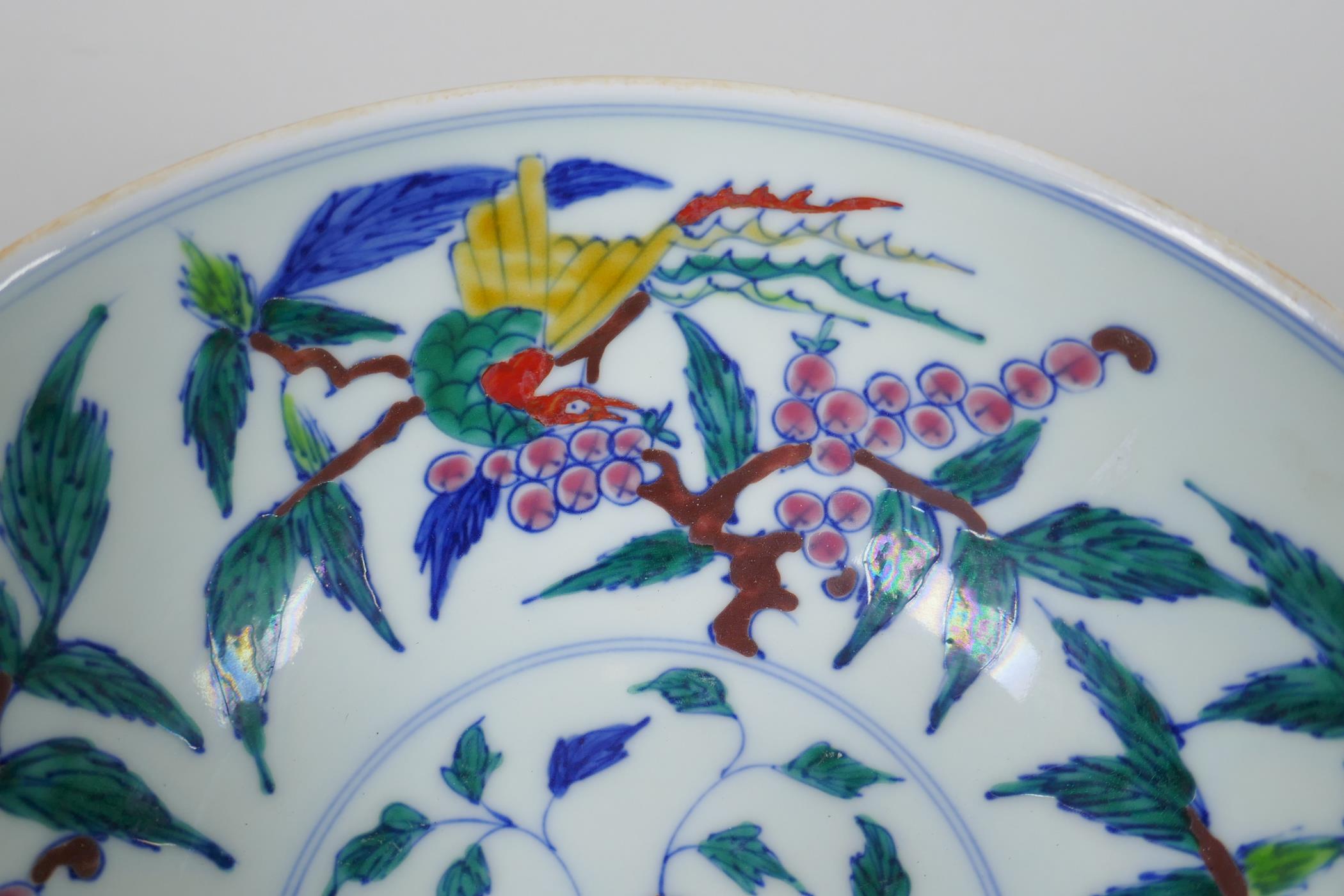 A Chinese porcelain bowl with wucai enamel bird decoration to the interior and incised dragon - Image 3 of 6