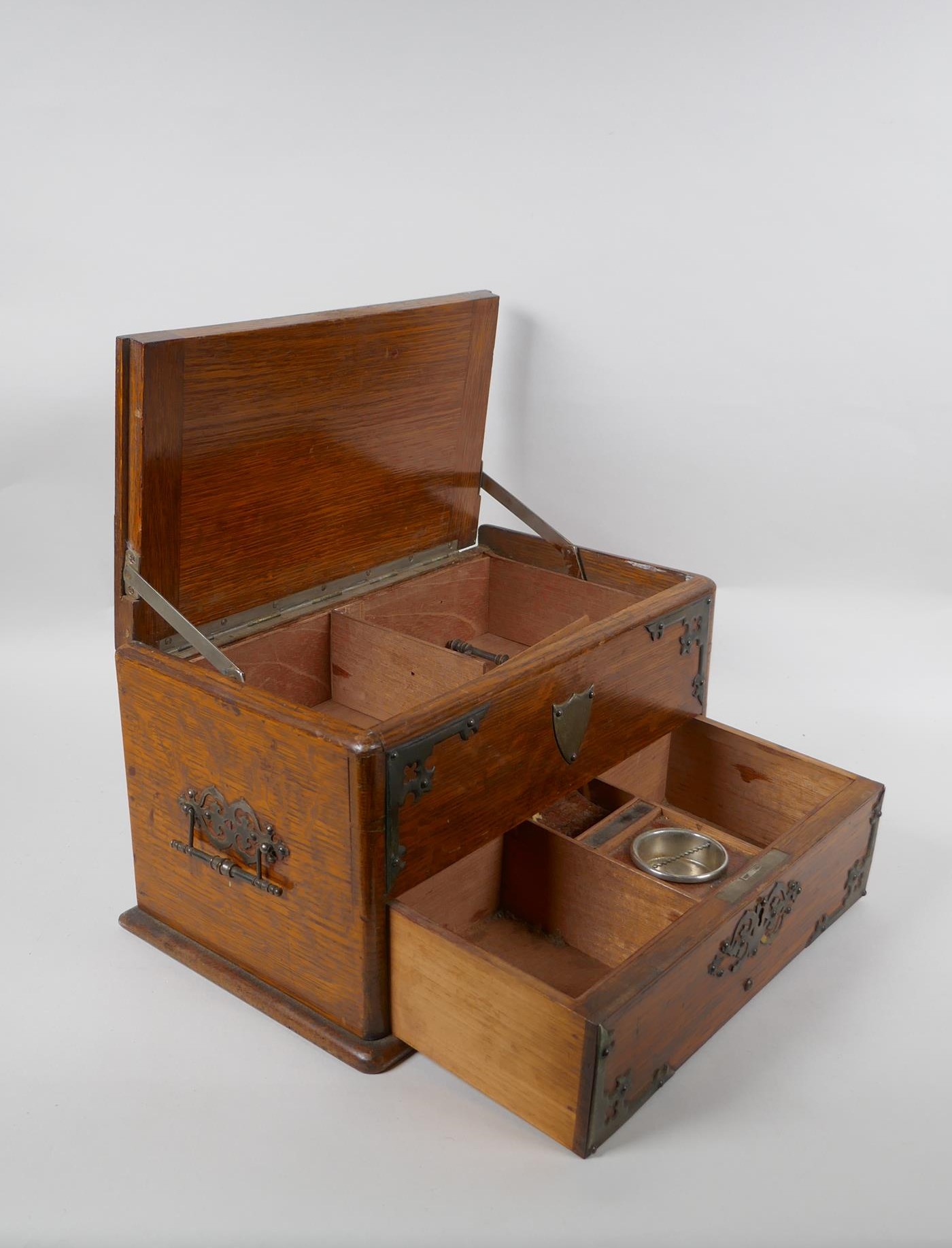 An antique oak smokers companion box with silver plated mounts, 33 x 20cm, 18cm high