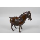 A Chinese bronze figure of a Tang style horse, 14cm high