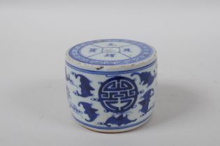 A Chinese blue and white porcelain drum shaped candlestick decorated with bats and auspicious