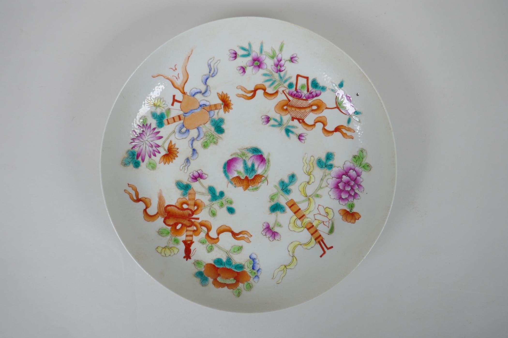 An early C20th Chinese famille rose porcelain cabinet dish, decorated with emblems of the Immortals,