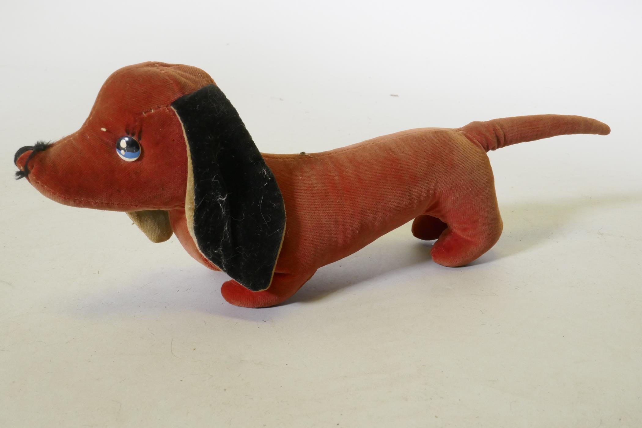 A vintage velvet toy dachshund, possibly Merrythought, 32cm long