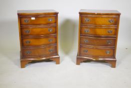 A pair of mahogany serpentine front four drawer bedside chests, raised on bracket supports, 49 x