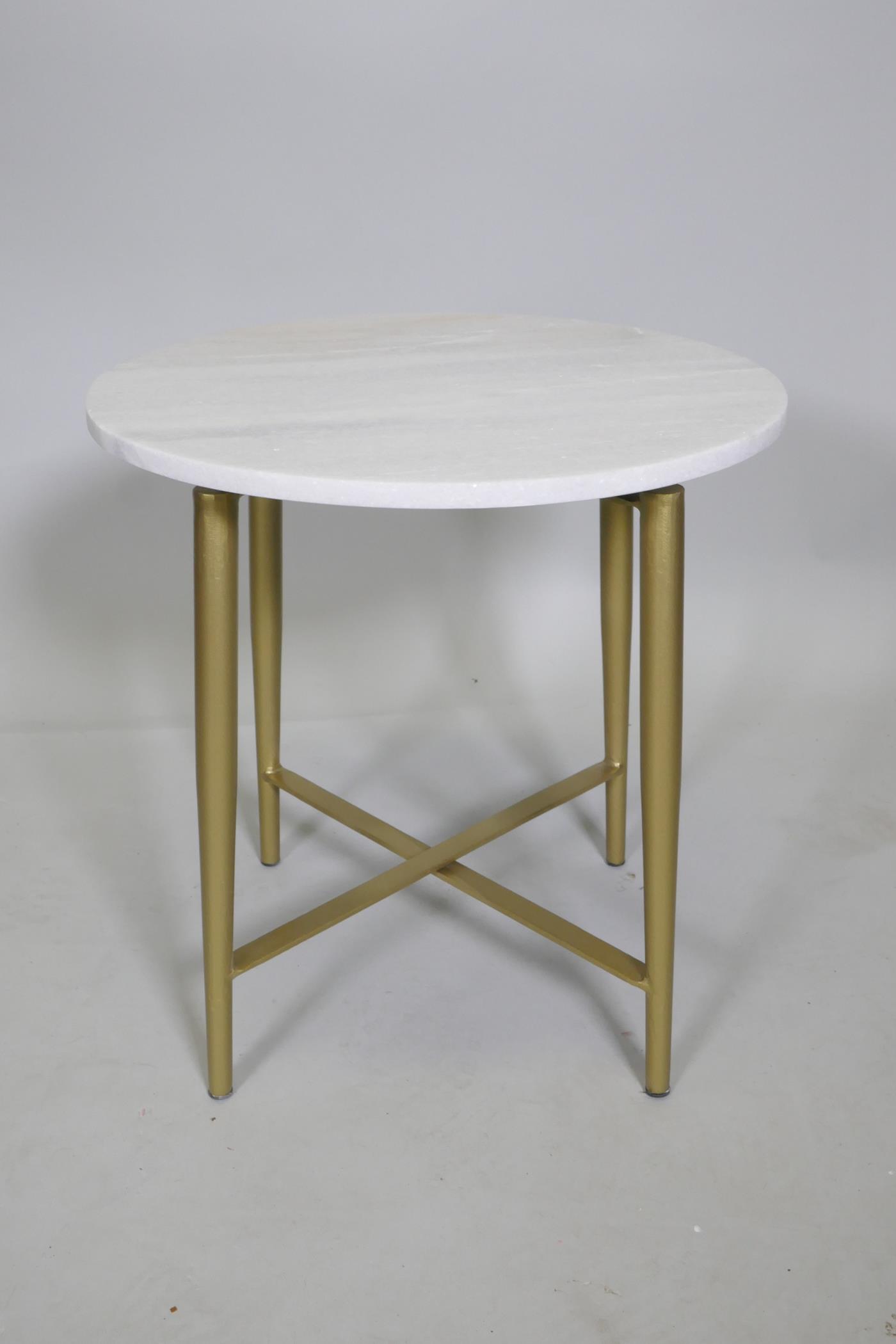 A contemporary stone topped occasional table with gilt metal legs, 44cm high x 43cm diameter