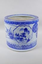 A Chinese blue and white porcelain cylinder jardiniere, with landscape and floral decoration, 26cm