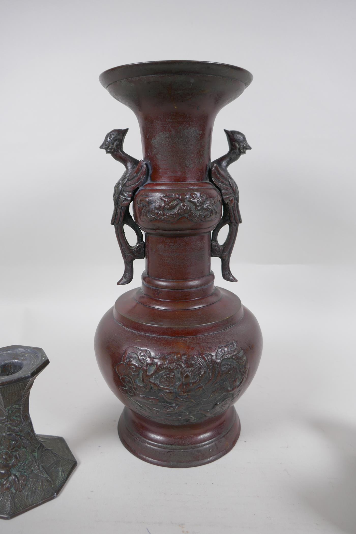 A pair of early C20th Japanese bronze candlesticks of hexagonal waisted form, with raised floral - Image 5 of 6