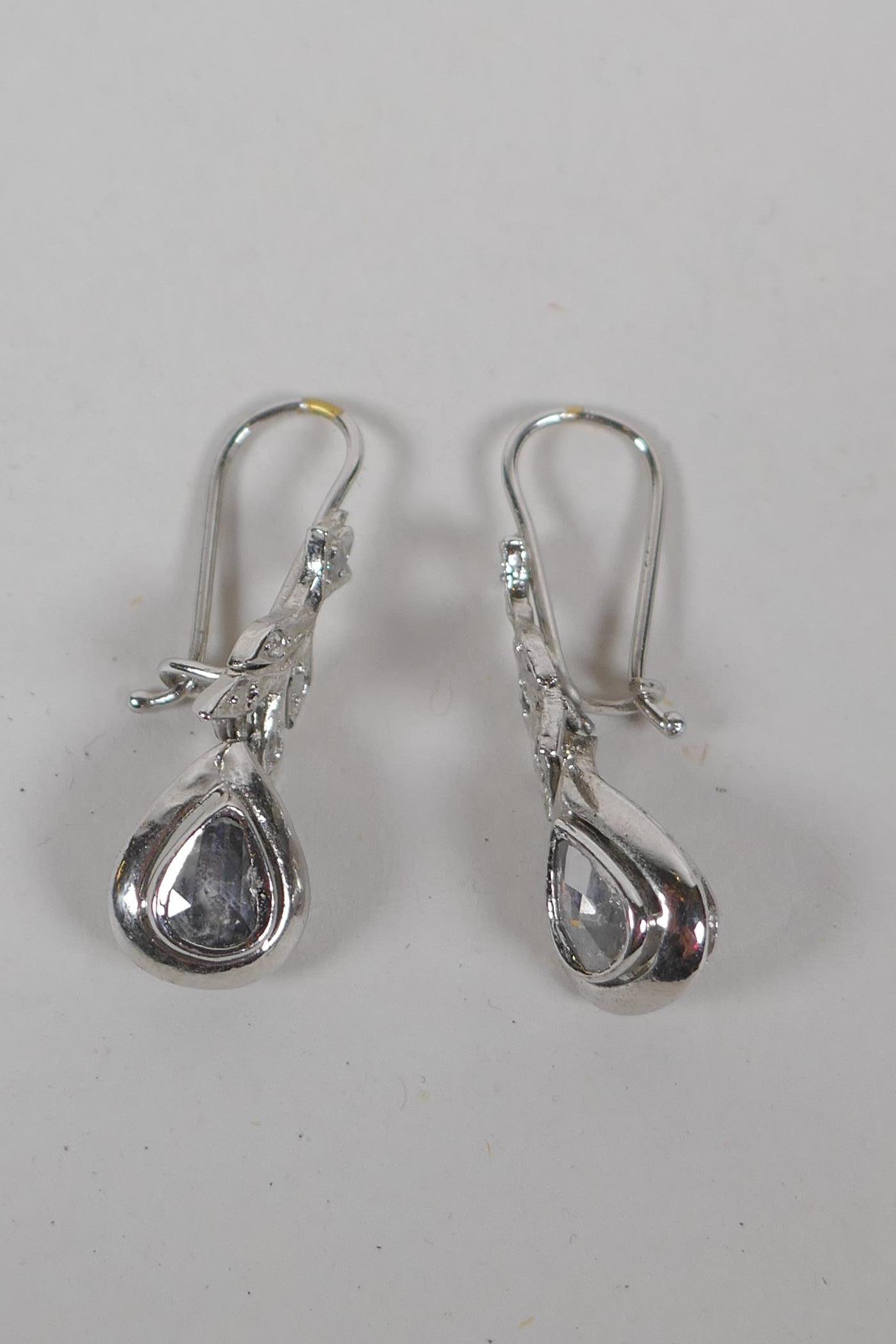 A pair of Iranian plated yellow metal drop earrings set with diamonds