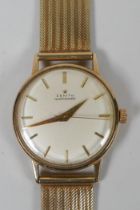A 9ct gold gentleman's Zenith Automatic wrist watch with gold hands and batons, 53g gross