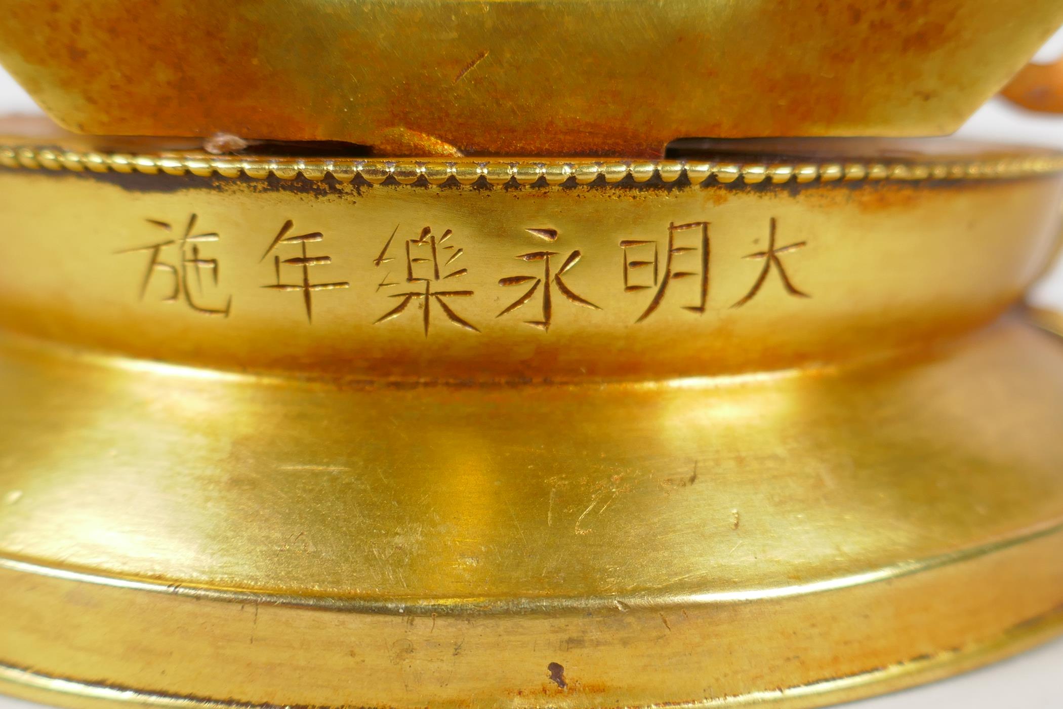 A Sino Tibetan gilt bronze figure of Buddha, double vajra mark to base, 17cm high - Image 4 of 5