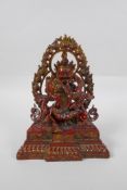 A Sino Tibetan copper lacquer bronze figure of a wrathful deity with remnants of gilt patina, 24cm